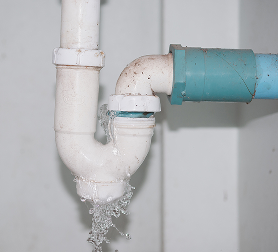 Close-up,Of,Water,Is,Leaking,From,The,White,Sink,Pipe